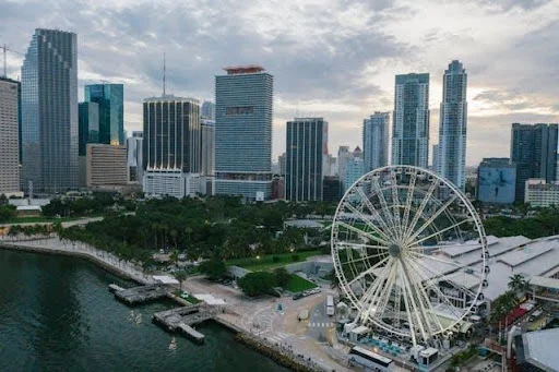 An aerial picture of tall buildings and a Ferris wheel